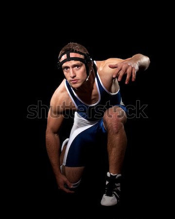 Wrestler in a blue singlet. Studio shot over black. Stock photo © nickp37