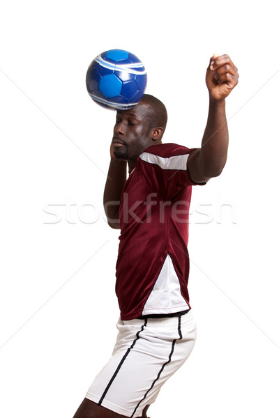 Male soccer player. Studio shot over white. Stock photo © nickp37