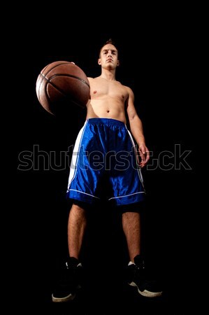 Male basketball player. Studio shot over black. Stock photo © nickp37