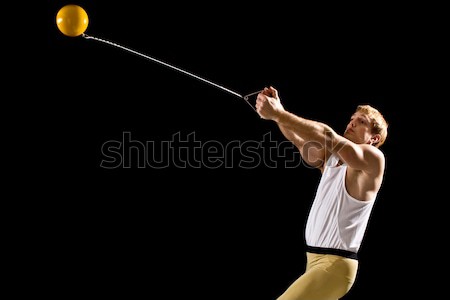 Track and field athlete competing hammer throw. Studio shot over white. Stock photo © nickp37