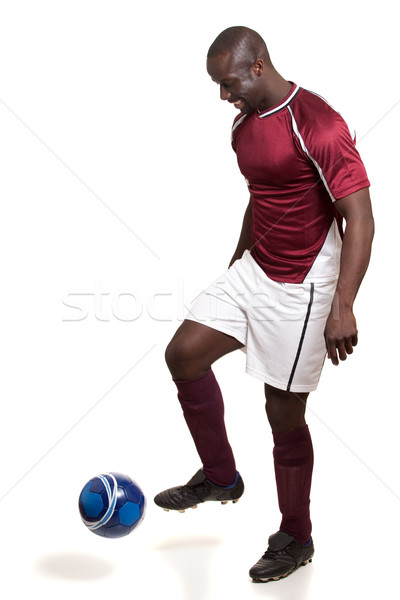 Male soccer player. Studio shot over white. Stock photo © nickp37