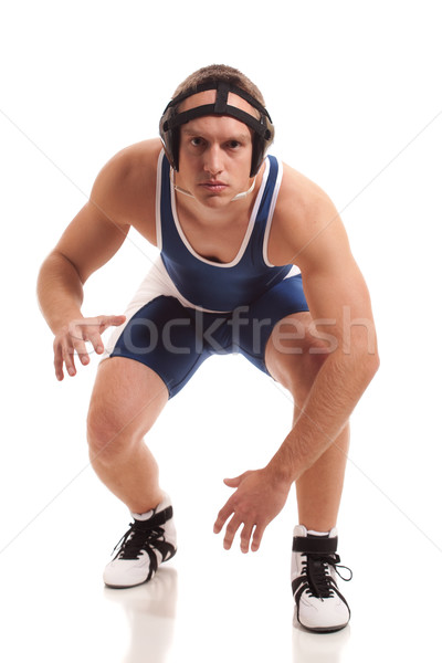 Wrestler in a blue singlet. Studio shot over white. Stock photo © nickp37