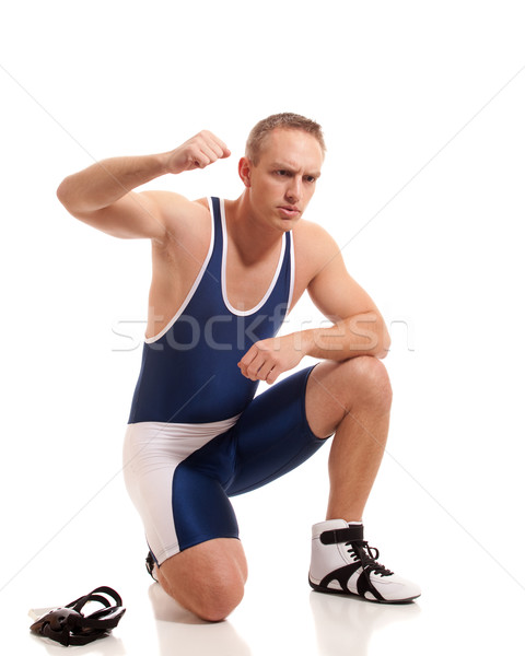 Wrestler in a blue singlet. Studio shot over white. Stock photo © nickp37