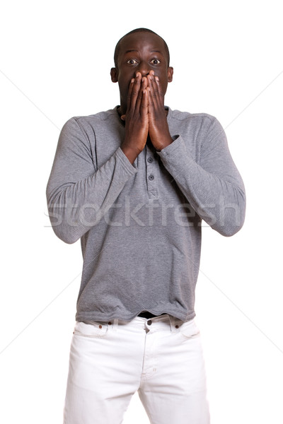 Man in grey shirt and white pants. Studio shot over white. Stock photo © nickp37