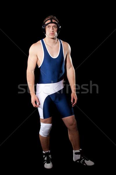 Wrestler in a blue singlet. Studio shot over black. Stock photo © nickp37