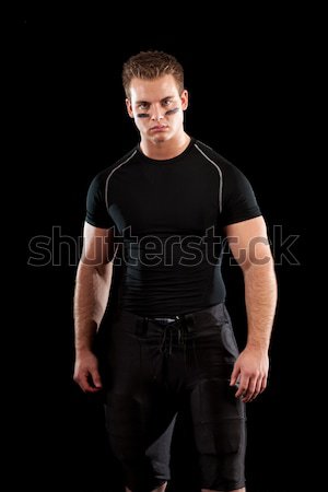 American football player. Studio shot over black. Stock photo © nickp37