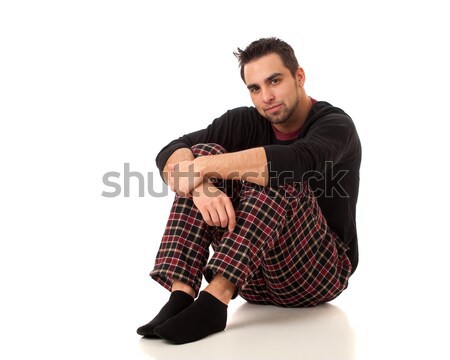 Attractive man in pajamas with a single red rose. Stock photo © nickp37