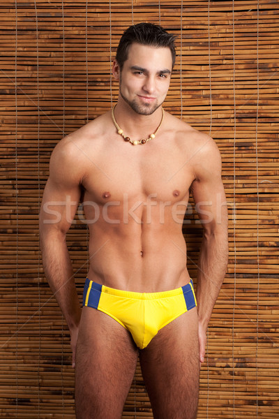 Attractive young man in swimsuit. Studio shot. Stock photo © nickp37