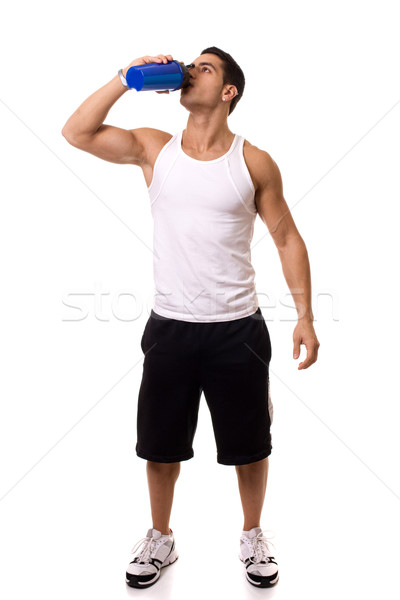 Stock photo: Athletic man with water bottle. Studio shot over white.