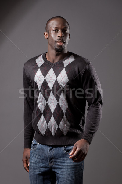 Casual male model. Studio shot over grey. Stock photo © nickp37