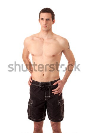 Man in board shorts. Studio shot over white. Stock photo © nickp37