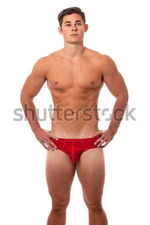 Attractive man in red underwear. Studio shot over grey. Stock photo © nickp37