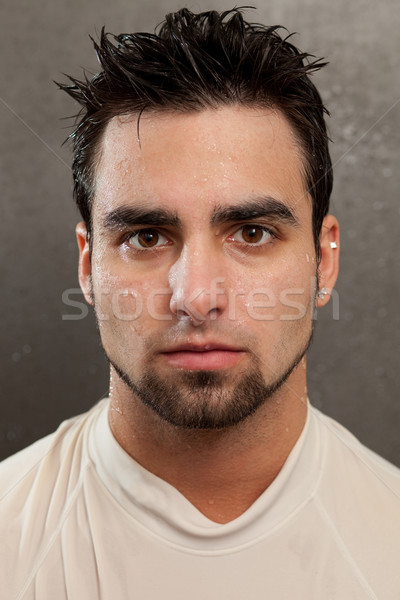Headshot on a young man. Wet look with grey background. Stock photo © nickp37