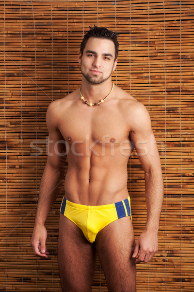 Attractive young man in swimsuit. Studio shot. Stock photo © nickp37