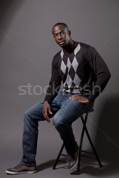 Casual male model. Studio shot over grey. Stock photo © nickp37