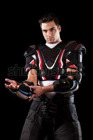 American football player. Studio shot over black. Stock photo © nickp37