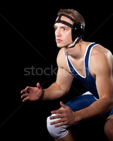 Wrestler in a blue singlet. Studio shot over black. Stock photo © nickp37