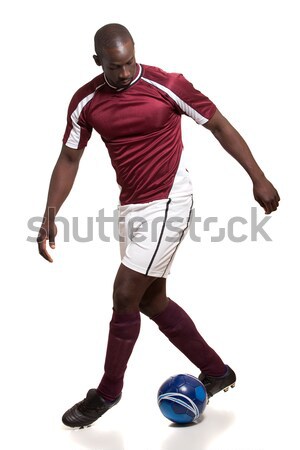 Male soccer player. Studio shot over white. Stock photo © nickp37