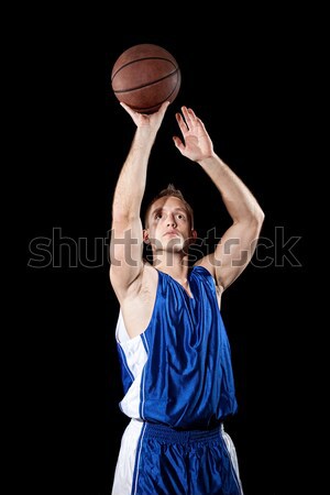 Male basketball player. Studio shot over black. Stock photo © nickp37