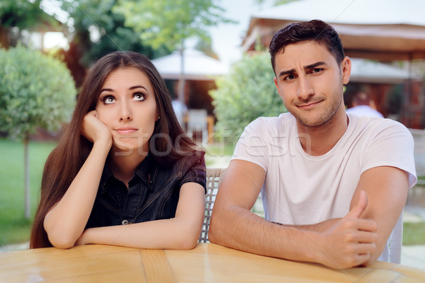 Woman and Man on a Boring Bad Date at the Restaurant Stock photo © NicoletaIonescu