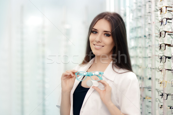 Stock photo: Happy Optician Choosing between Glasses and Contact Lenses