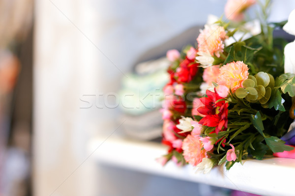 Flower Bouquet on Clothing Shelf  Stock photo © NicoletaIonescu