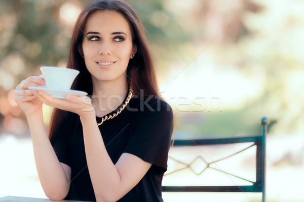 Beautiful Woman with Statement Necklace Having a Cup of Coffee  Stock photo © NicoletaIonescu