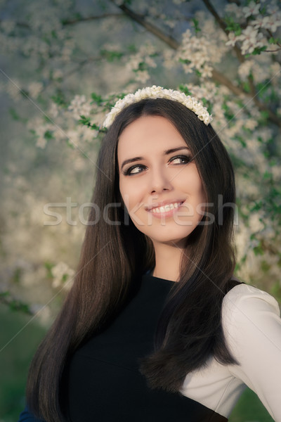 Portrait of a Happy Girl with Floral Wreath Outside Stock photo © NicoletaIonescu