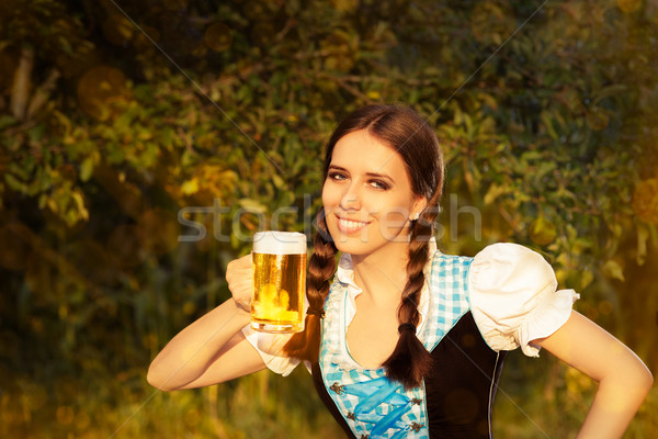 Young Bavarian Woman Holding Beer Tankard  Stock photo © NicoletaIonescu
