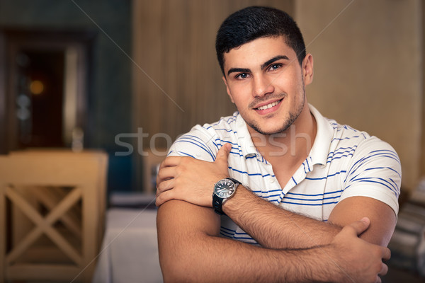 молодым человеком сидят ресторан портрет человека Сток-фото © NicoletaIonescu