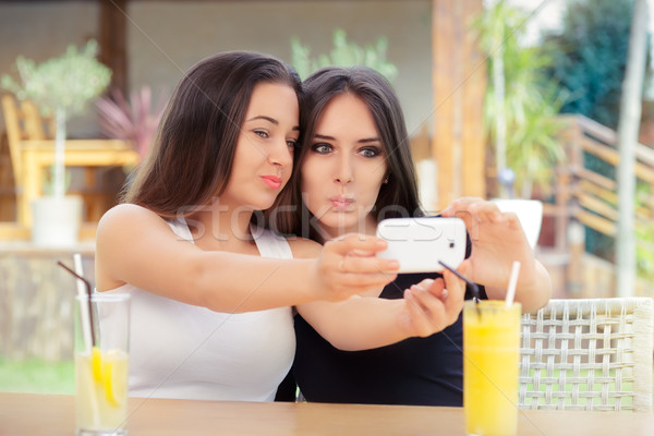 Funny Girls Taking a Selfie Together Stock photo © NicoletaIonescu