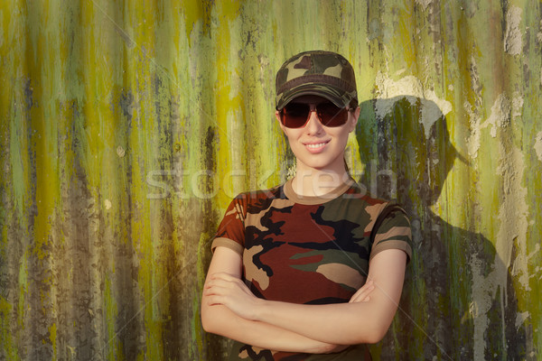 Smiling Young Woman Soldier in Camouflage Outfit Stock photo © NicoletaIonescu