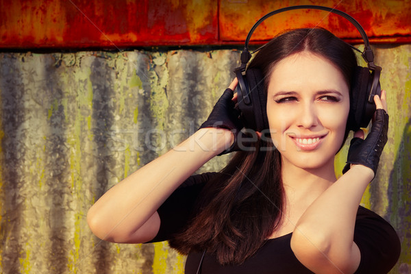 Girl with Big Headphones on Grunge Background  Stock photo © NicoletaIonescu