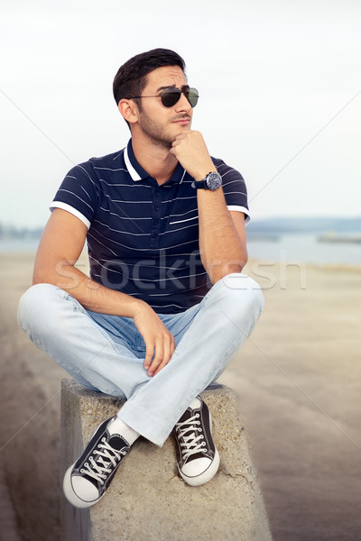 Young Man Thinking by the Water Stock photo © NicoletaIonescu