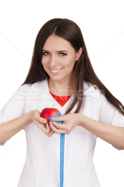 Táplálkozástudós orvos mér alma gyümölcs nő Stock fotó © NicoletaIonescu