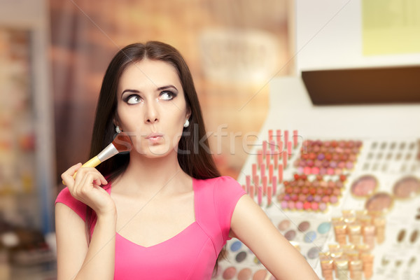 Surprised Girl Holding a Make-up Brush Stock photo © NicoletaIonescu