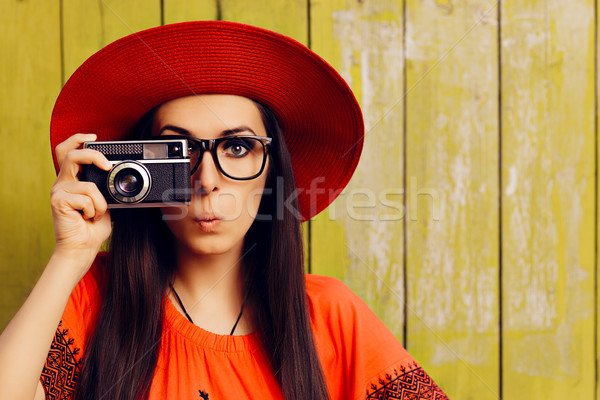 Funny Girl with Retro Photo Camera and Red Sun Hat Stock photo © NicoletaIonescu