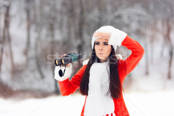 Surprised Winter Woman with Binoculars Looking for Christmas Stock photo © NicoletaIonescu