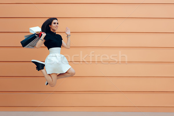 Happy Woman Running With Shopping Bags in Summer Sale Season Stock photo © NicoletaIonescu