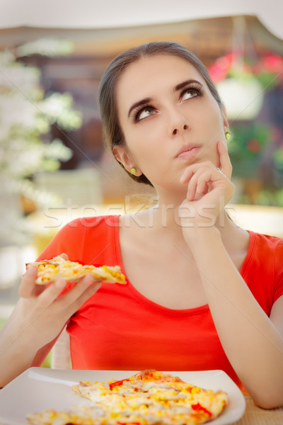 Young Woman Thinking About Eating Pizza on a Diet  Stock photo © NicoletaIonescu