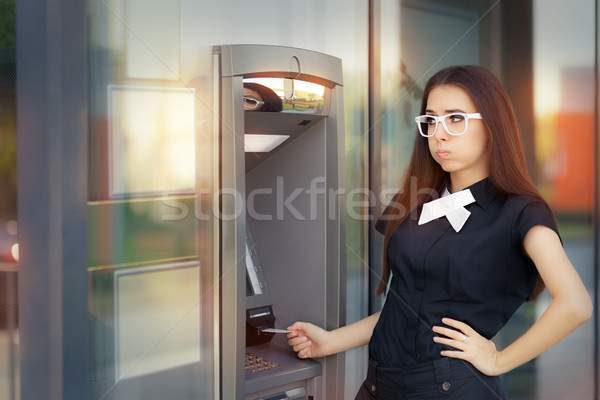 Stressed Woman with credit card at ATM Stock photo © NicoletaIonescu