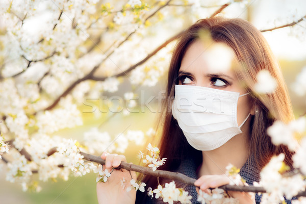 Woman with Respirator Mask Fighting Spring Allergies Outdoor Stock photo © NicoletaIonescu