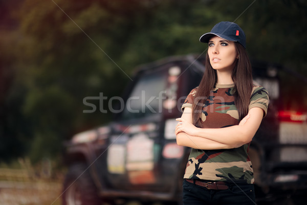 Female Driver in Army Outfit Next to an Off Road Car Stock photo © NicoletaIonescu