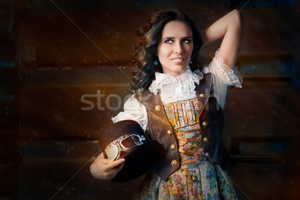 Steampunk Girl with Top Hat and Aviator Glasses  Stock photo © NicoletaIonescu