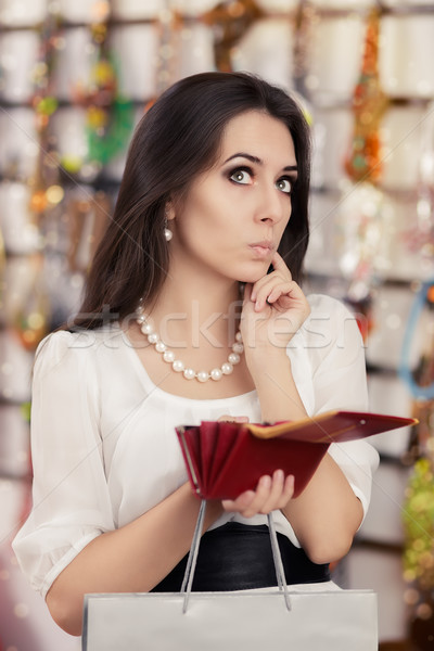 Cute Broke Woman at  Shopping Checking Wallet Stock photo © NicoletaIonescu