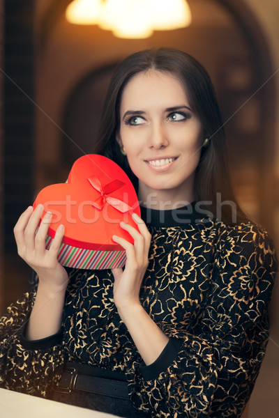 Beautiful Elegant  Woman Opening Heart Shape Gift Stock photo © NicoletaIonescu