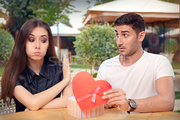 Girl Refusing Heart Shaped Gift From Her Boyfriend Stock photo © NicoletaIonescu