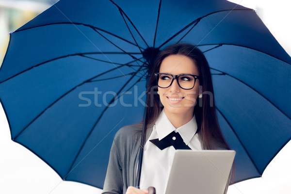 Happy Woman with Glasses, Tablet and Umbrella Out in the City Stock photo © NicoletaIonescu