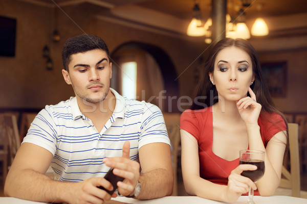 Curious Girl Spying Boyfriend on Smartphone Stock photo © NicoletaIonescu