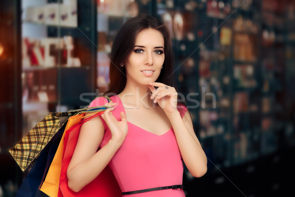 Feliz mujer compras tienda sonriendo nina Foto stock © NicoletaIonescu